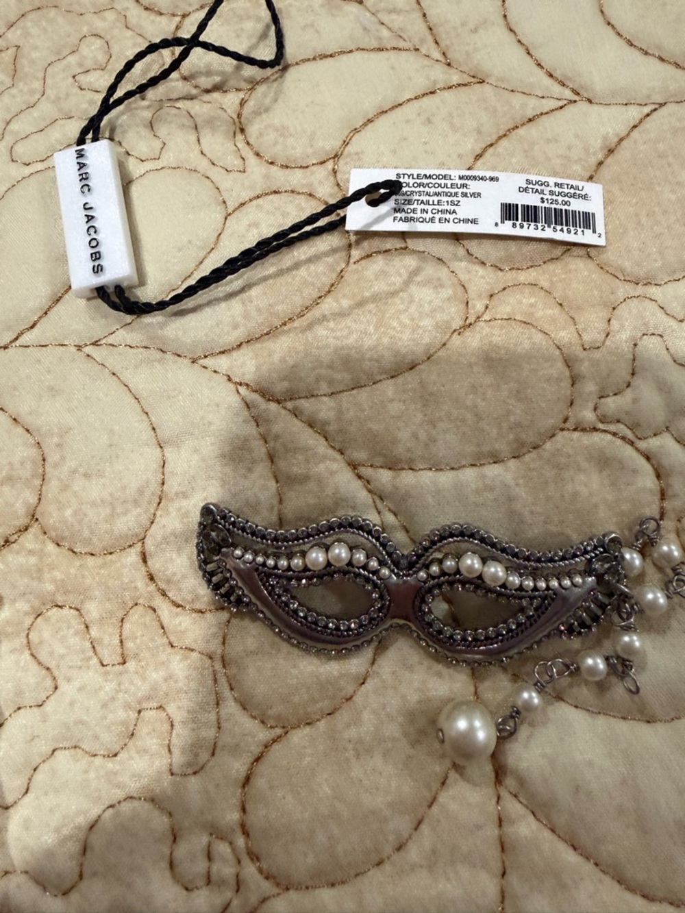 This Marc Jacobs masquerade mask brooch in crystal and antique silver like new